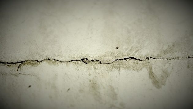 extensive crack in a slab foundation that is leaking water