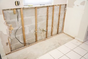 damage to a home's interior walls and floors after a slab leak