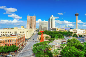 a view of downtown San Antonio with roads and tall buildings visible
