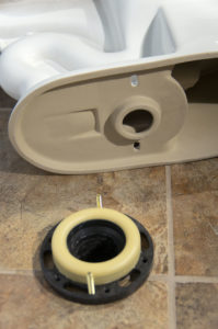 parts for a toilet installation on a bathroom floor in Shavano Park