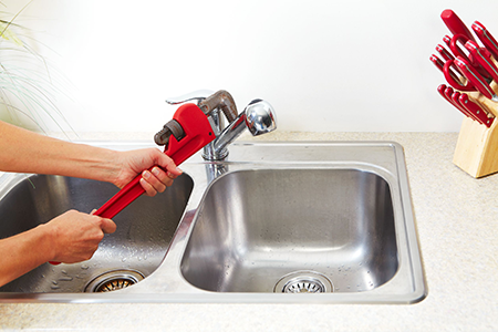 plumber performing sink repair services in Bexar county