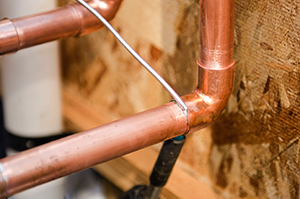 pipes in a home plumbing system in the middle of the repair process