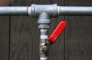 silver pipes with a red on and off switch connected to them in Castle Hills