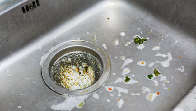 food waste gathered in a drain and creating a bad smell