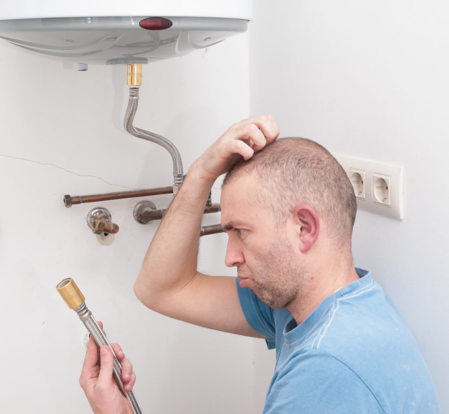 a confused man trying to install a water heater