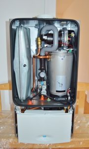a water heater opened up and exposing parts for repair services