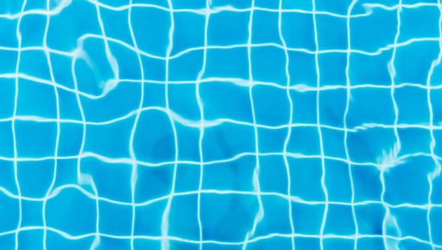 water reflecting the floor of a swimming pool