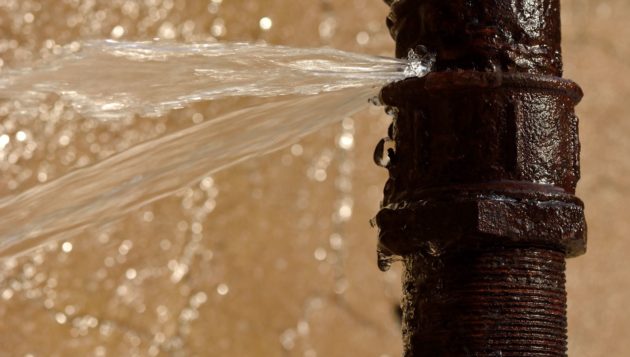 water spraying from a broken pipe