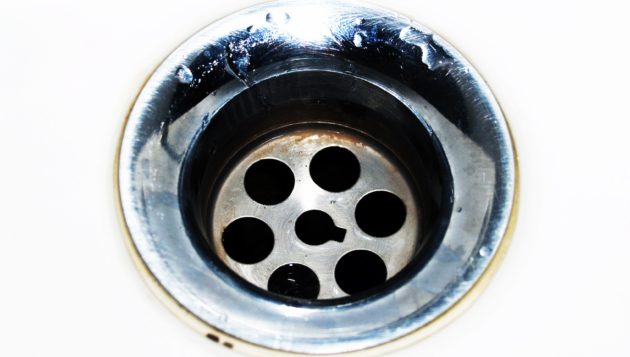 a dirty and clogged drain that is small in size
