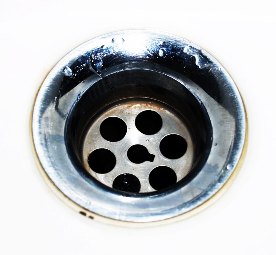 a dirty and clogged drain that is small in size