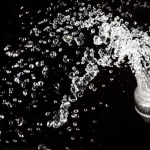 splashes of water against a black background