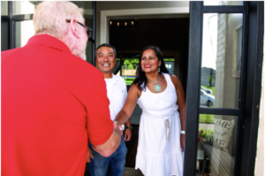 a man shaking the hand of San Antonio homeowners