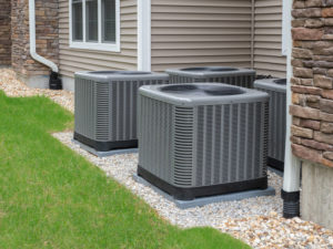 a group of four hvac systems installed next to a San Antonio building