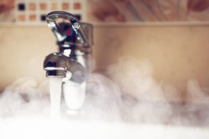 a bathroom sink in Saint Hedwig running hot water and creating steam