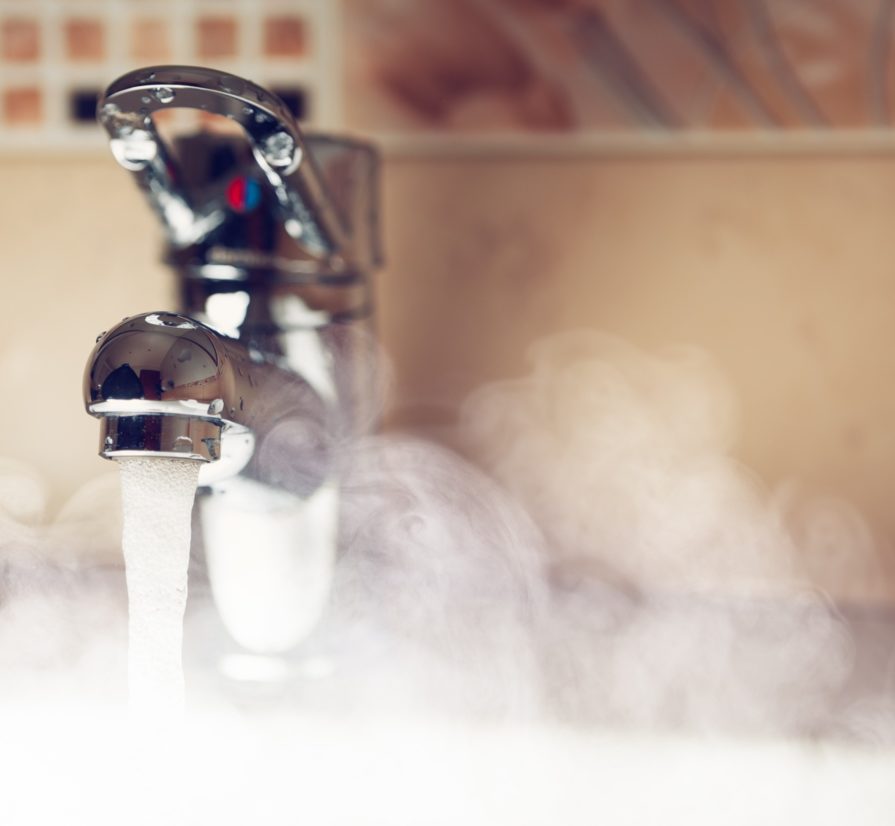 a bathroom sink in Saint Hedwig running hot water and creating steam